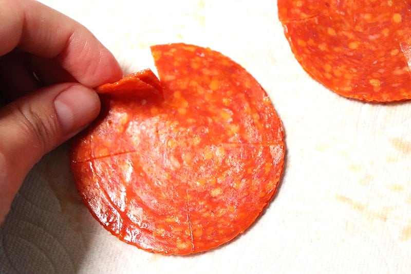 Cut pepperonis for healthy pizza bites