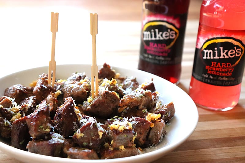 Close up of steak bites with mikes hard lemonade in the background