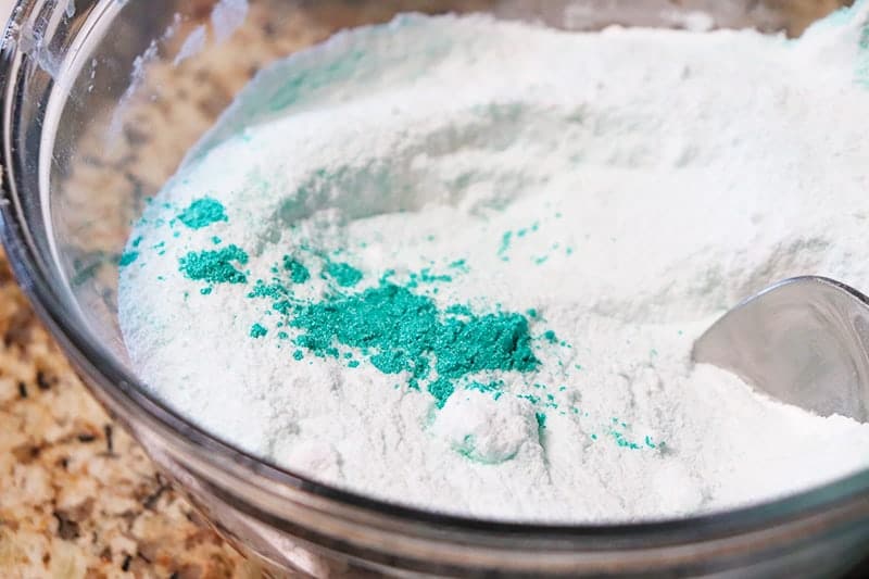 Citric acid, epsom salt, baking soda, and cornstarch with natural coloring pigment for bath bombs